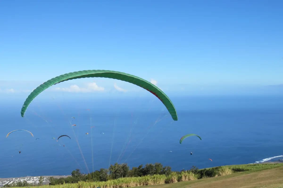 Tandem paragliding flight above the lagoon of Réunion Island